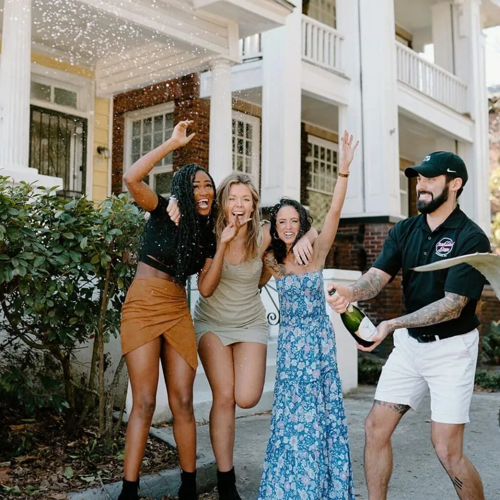 a group of people standing in front of a building