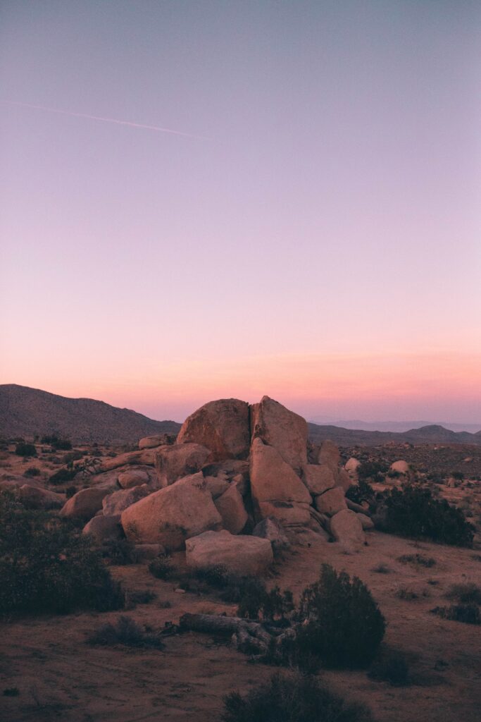 a canyon with a sunset in the background