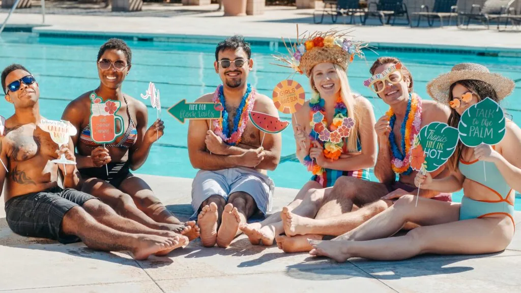 a group of people sitting at a beach