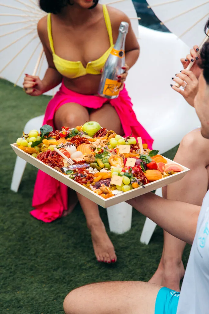 a woman holding a plate of food