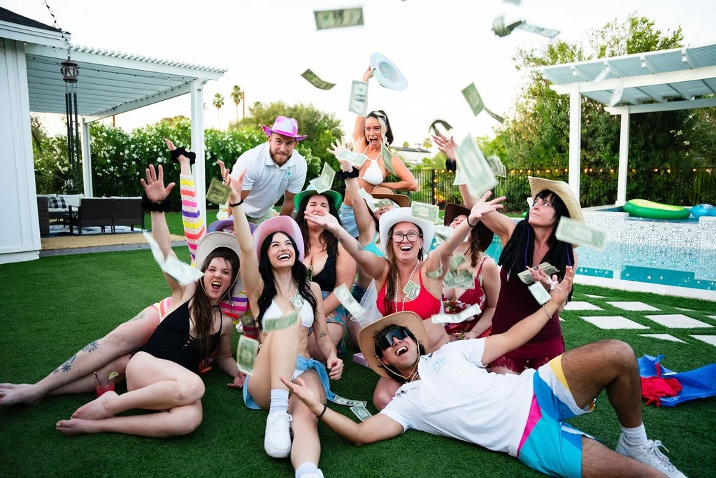 Diverse group of Party Host Boys hosts and female guests posing together at an indoor event