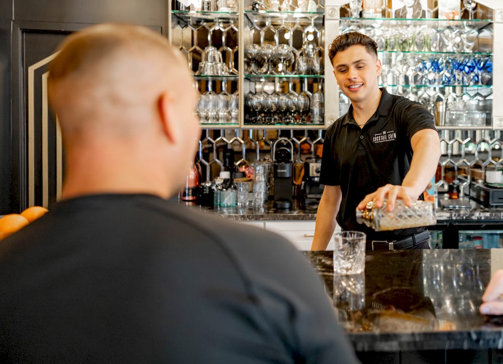 Couple planning themed cocktail party at kitchen table