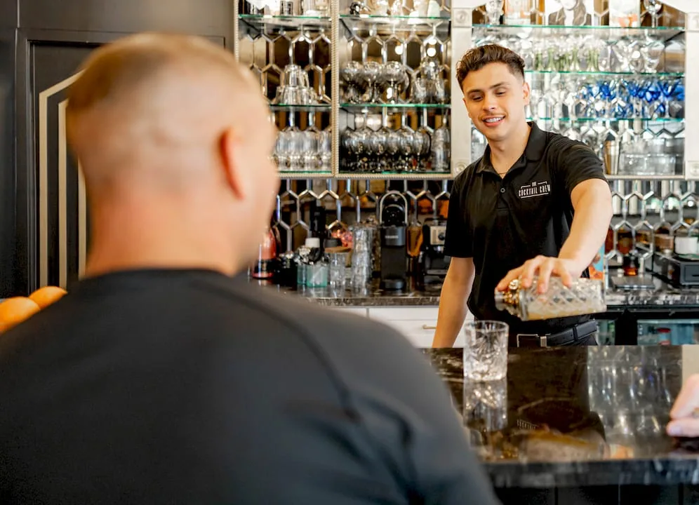 Couple planning themed cocktail party at kitchen table